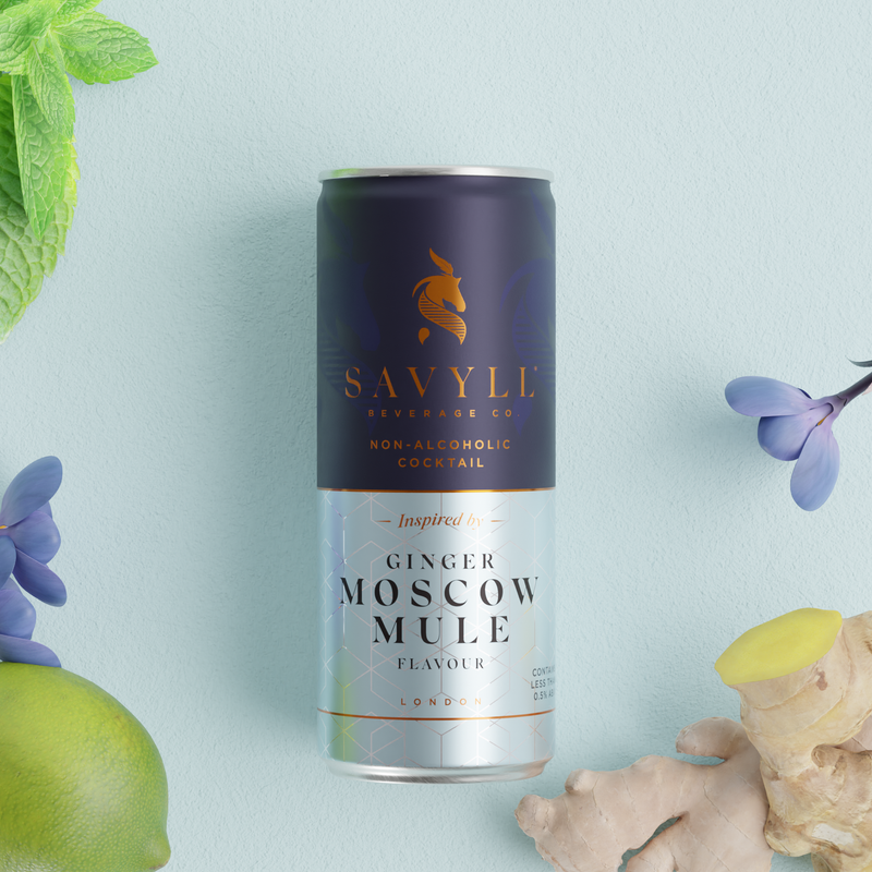 Can of Savyll non-alcoholic Ginger Moscow Mule cocktail surrounded by lime, ginger, mint, and purple flowers.