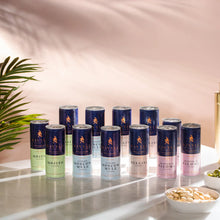 Twelve-pack of Savyll alcohol-free cocktails in Mojito, Ginger Moscow Mule, Bellini, and Grapefruit Paloma flavors on a marble surface.