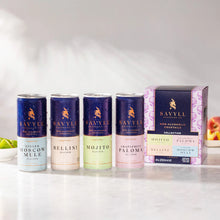 Four cans of Savyll alcohol-free cocktails in flavors Ginger Moscow Mule, Bellini, Mojito, and Grapefruit Paloma next to their mixed 4-pack 