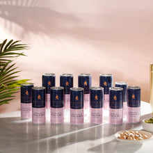 Twelve cans of Savyll non-alcoholic grapefruit Paloma cocktail on a marble surface with snacks nearby.